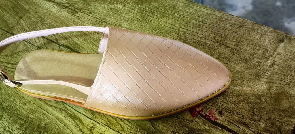 Women's flat buckle sandals with a pointed toe in blue, showing the microfiber upper and rubber sole.