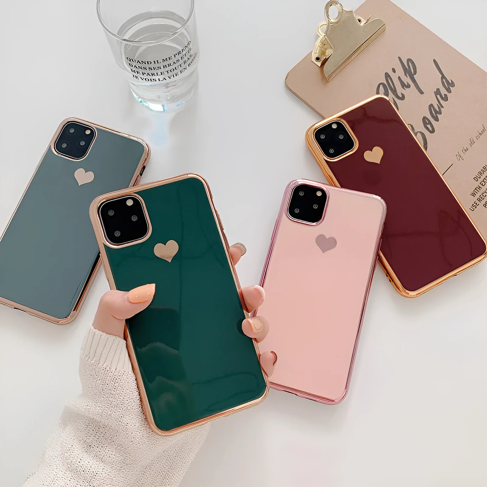 A solid colour TPU back cover case for an iPhone, shown in blue, claret, pink, and green colour options.