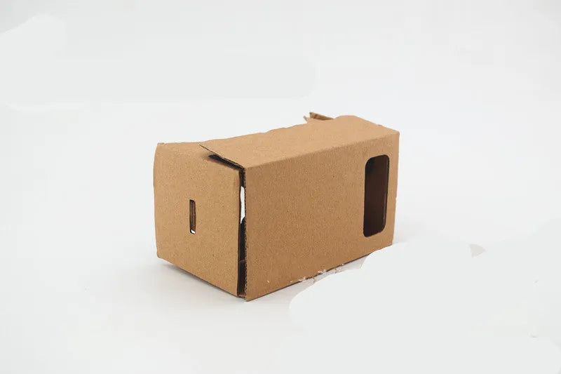 Pink and white VR cardboard glasses for smartphones with adjustable head strap.