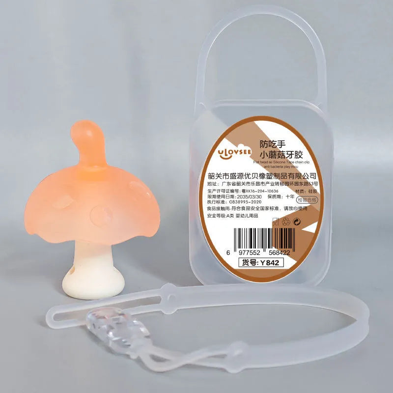 Small pink mushroom-shaped silicone gel fidget gum inside a transparent box