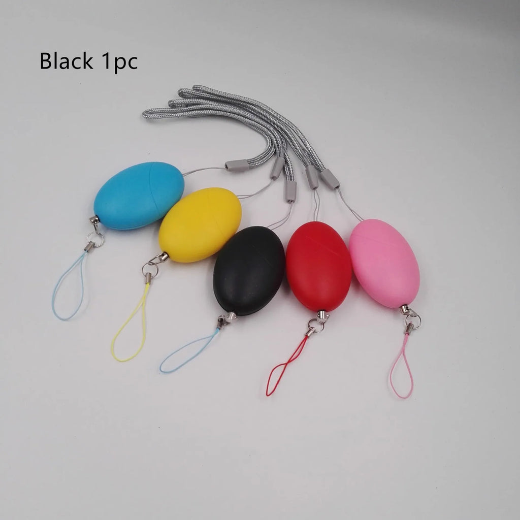 Oval personal alarm in black, blue, pink, red or yellow, 120dB wolf guard anti-tracking keyring alarm for women, elderly and children.