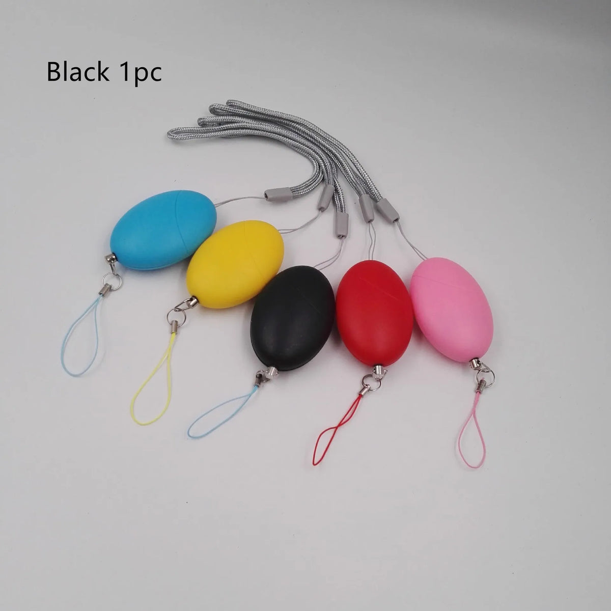 Oval personal alarm in black, blue, pink, red or yellow, 120dB wolf guard anti-tracking keyring alarm for women, elderly and children.