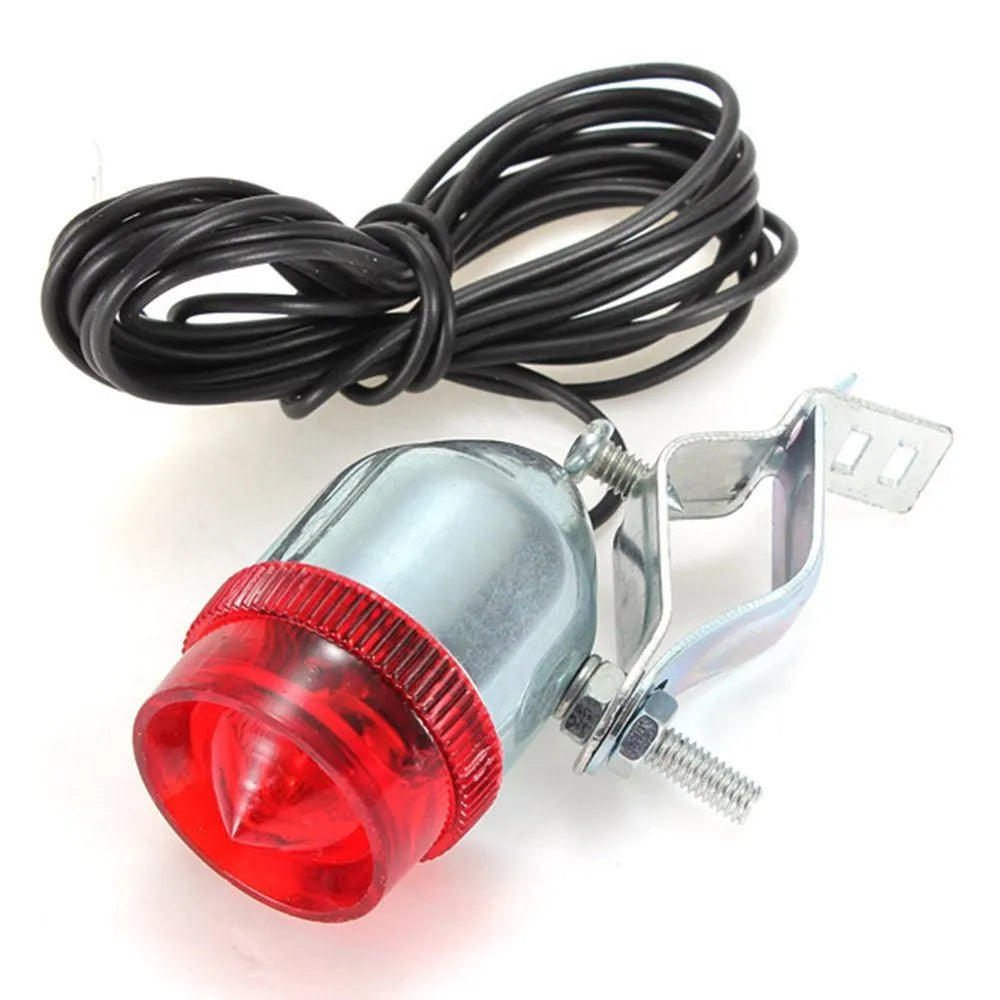 Silver bicycle dynamo generator light kit showing generator unit, wiring, and connectors for front or rear mounting.