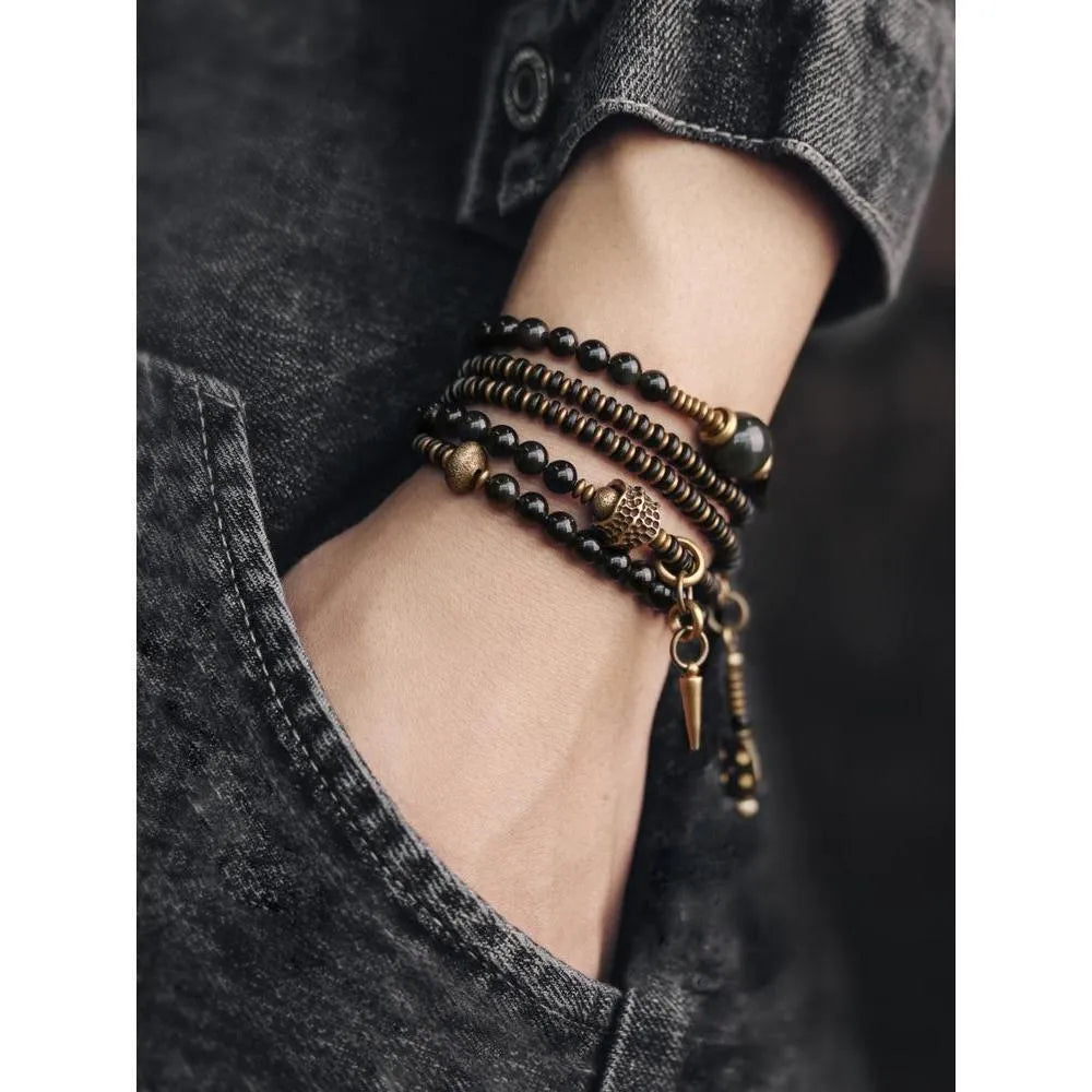Black geometric multi layered bead bracelet with retro colourful beads on adjustable strap