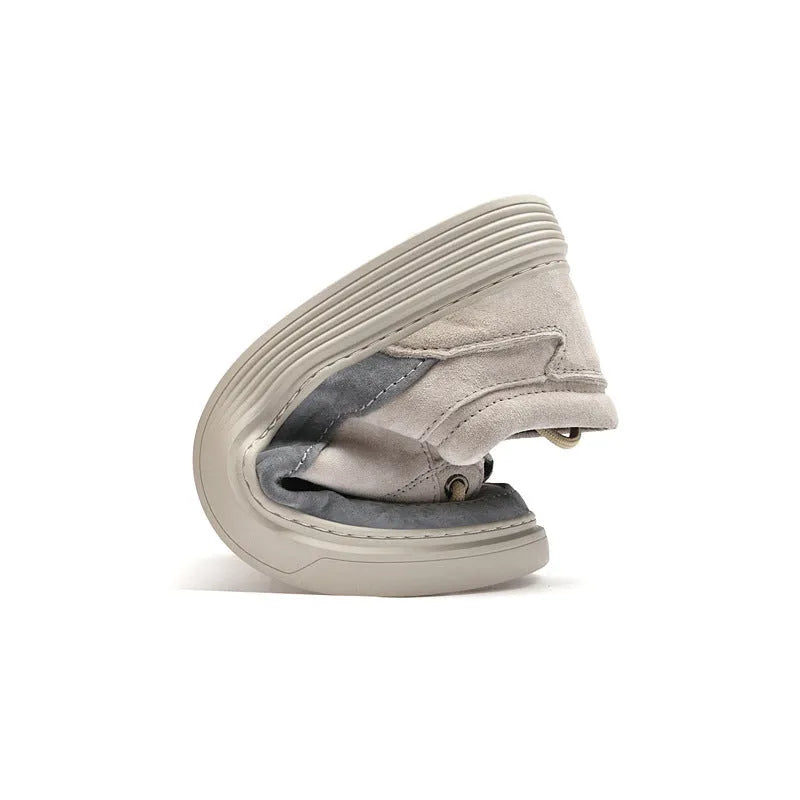 Men's grey casual skate shoes with pigskin upper and rubber sole on white background