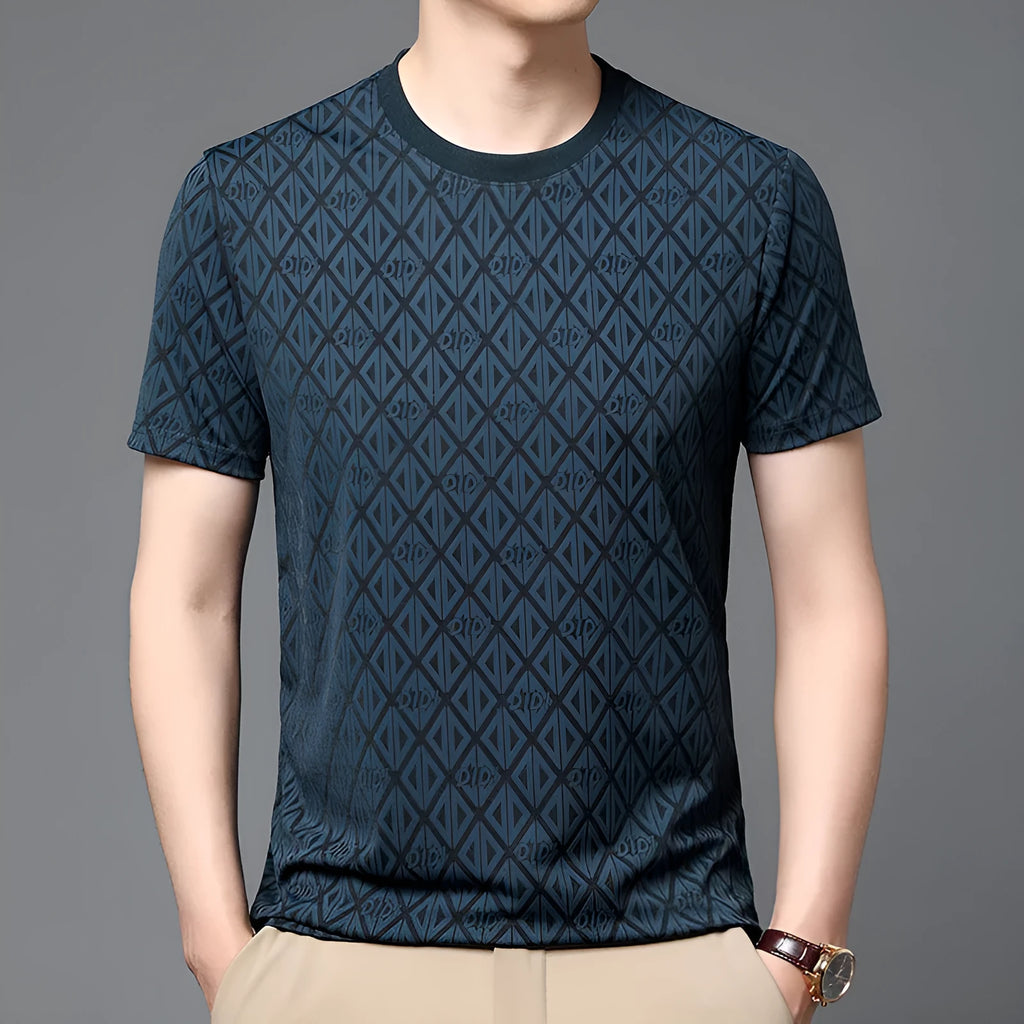 Man wearing a loose fit round neck short sleeve shirt in ice silk fabric.