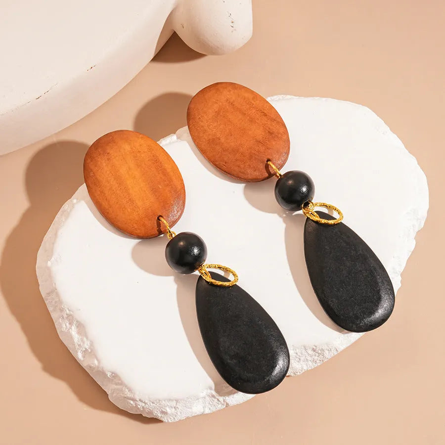 Retro wooden ellipse earrings handmade in brown-black colour with silver needle detailing