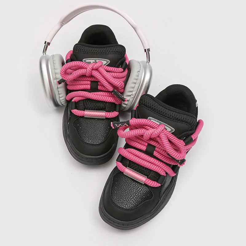 A pair of low-top casual sneakers with a thick rubber sole and front lace-up closure, shown in a choice of four colours.
