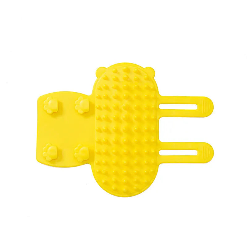 Silicone cat grooming comb scratcher with adjustable strap mounted on a table leg