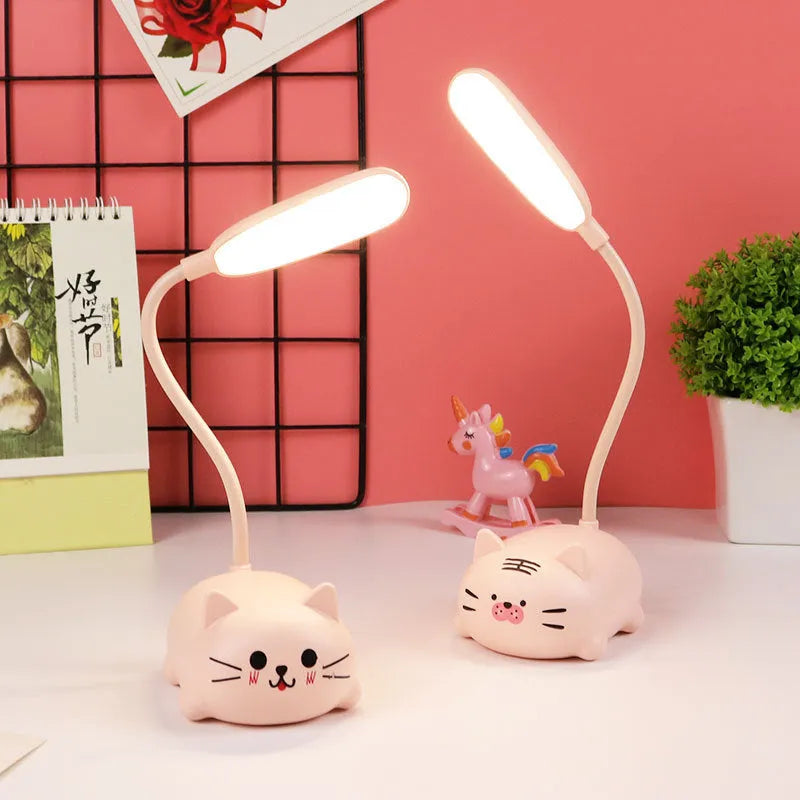 USB rechargeable LED book light in warm white, available in blue or pink with animal designs