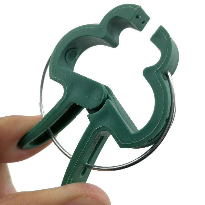 Green plastic and zinc plant support clips, showing large and small sizes for climbing plants.