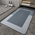 Cushioned blended fabric bathroom floor mat in blue colour, oval shape on a tiled floor.