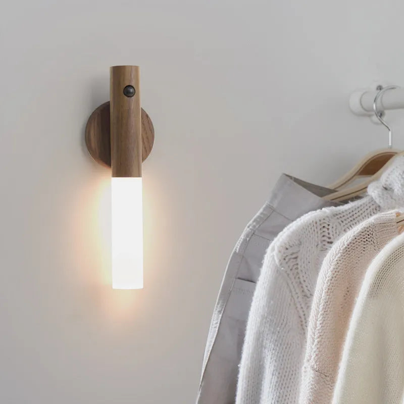 Smart sensor LED desk lamp in solid wood and organic glass with automatic motion activation.