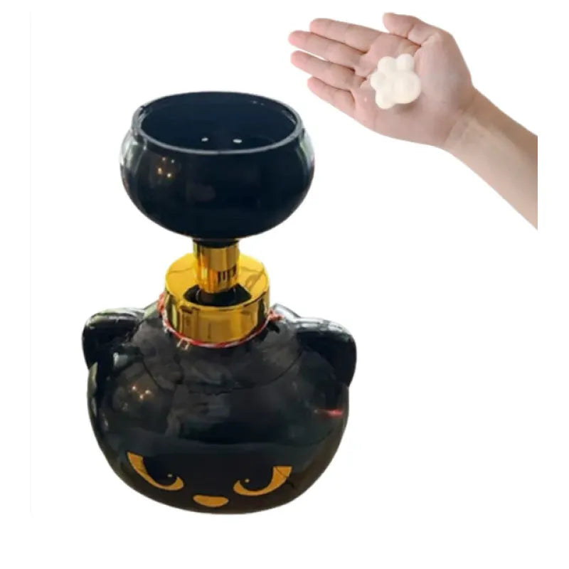 Black cartoon cat-shaped plastic foam soap dispenser on a bathroom counter.