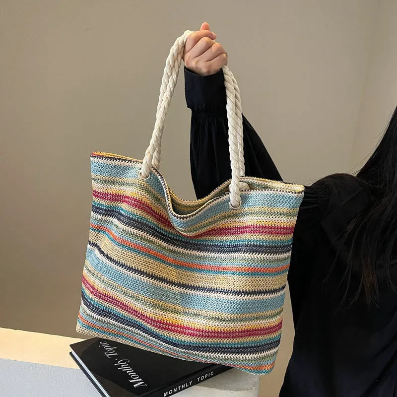 Blue woven nylon shoulder bag with large capacity and straw-style texture showing single-shoulder strap and polyester lining.