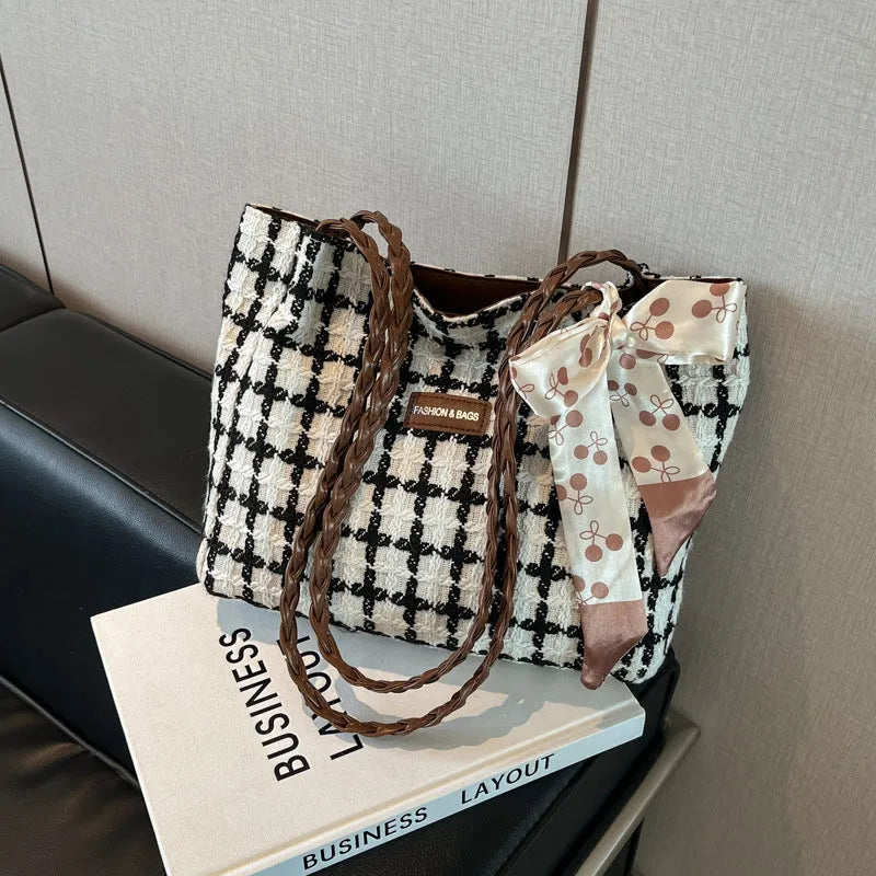 Black wool shoulder bag with horizontal square shape and internal organisation compartments