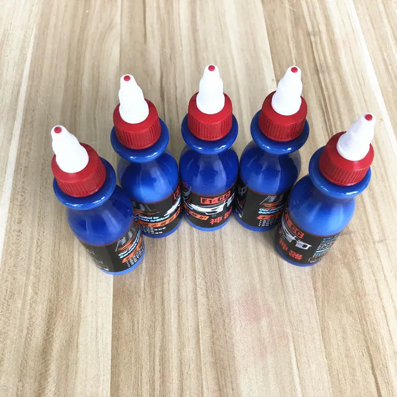 Automobile scratch repair kit with blue wiping tool and repair agent bottle for car paint restoration
