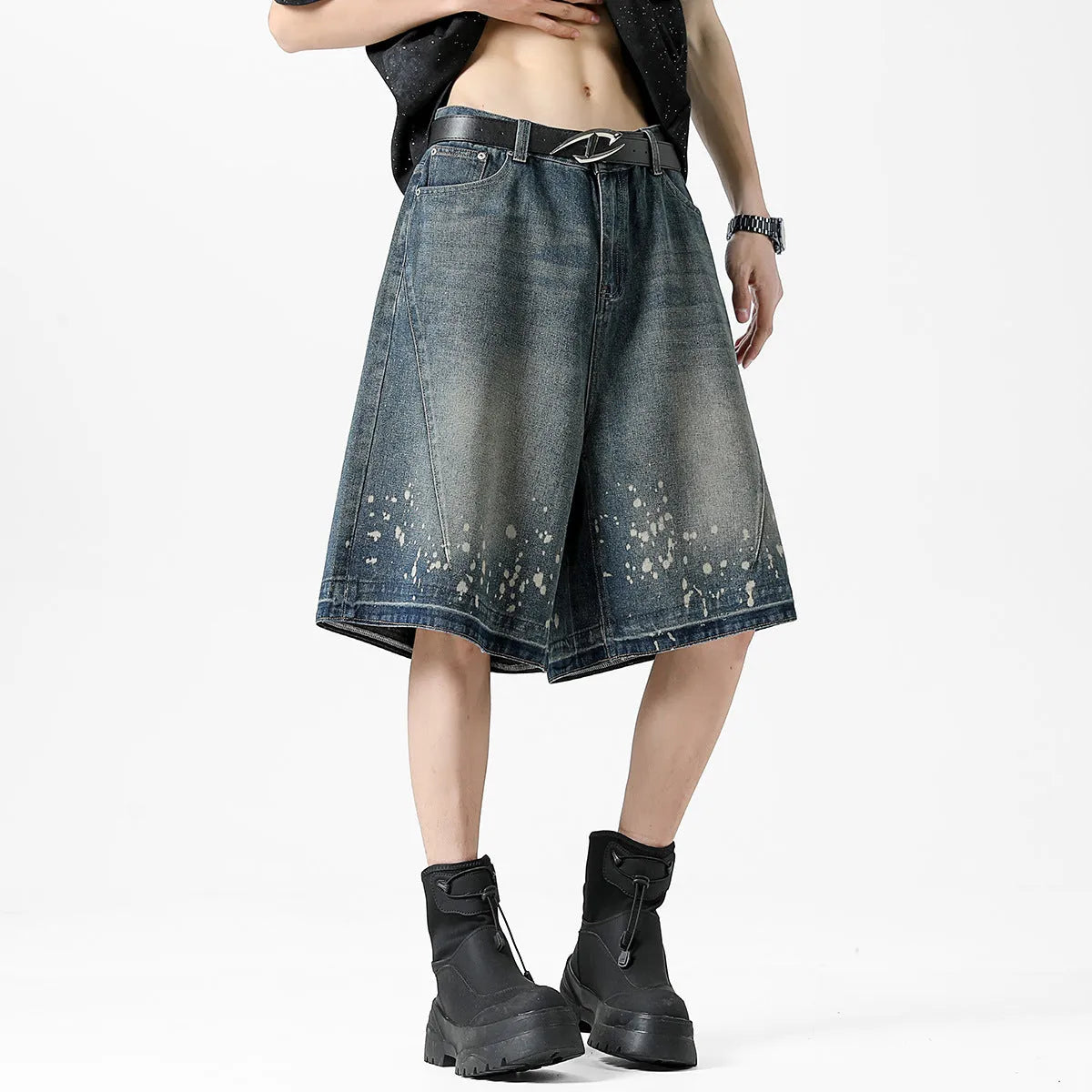 Men's retro blue washed denim shorts with ripped and splash ink distressing detail on straight-leg cut