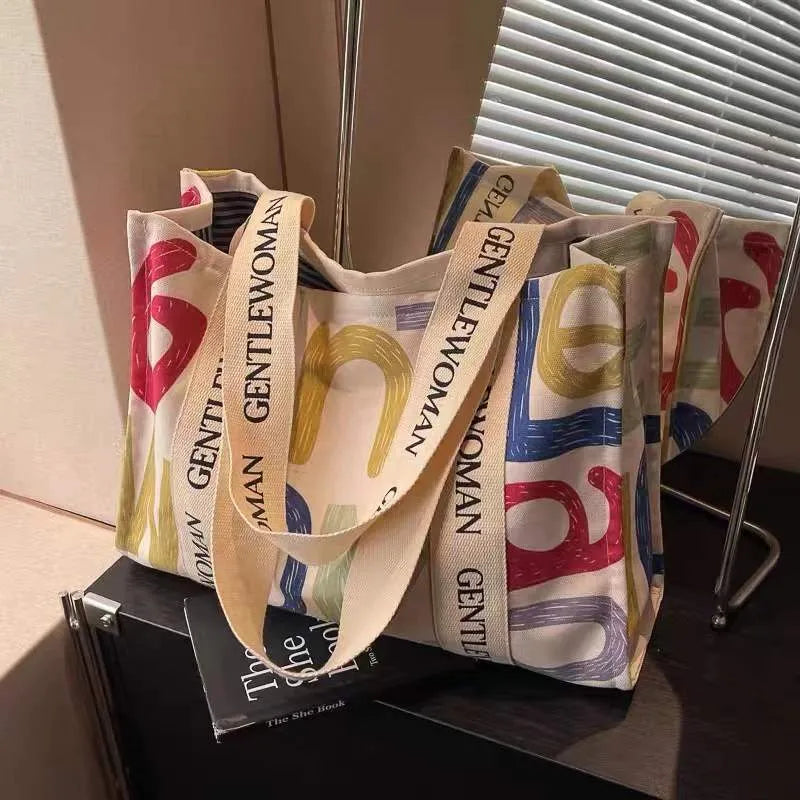 Large capacity canvas tote bag with printed letter design for women's travel and shopping
