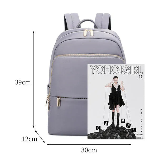 Oxford cloth women's backpack in black and purplish grey colours, showing large main compartment.