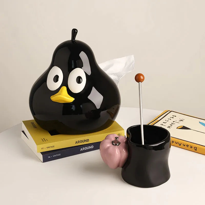 White porcelain pear-shaped ceramic tissue box in green colour on wooden desktop