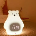 White silicone bear-shaped night light with colour-changing lights and a remote control.