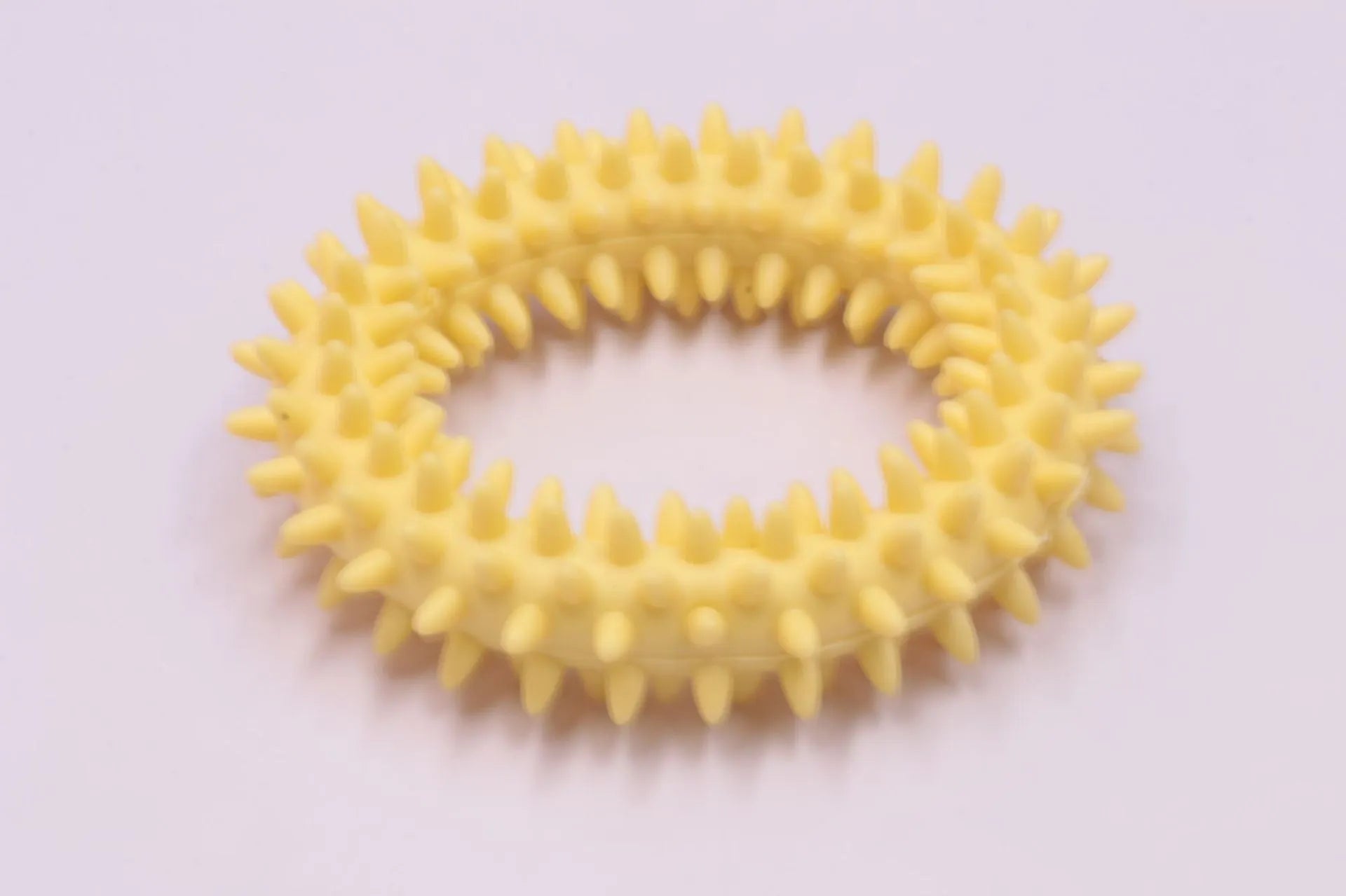 TPR spiky circle ring dog chew toy in blue with textured dental cleaning nubs