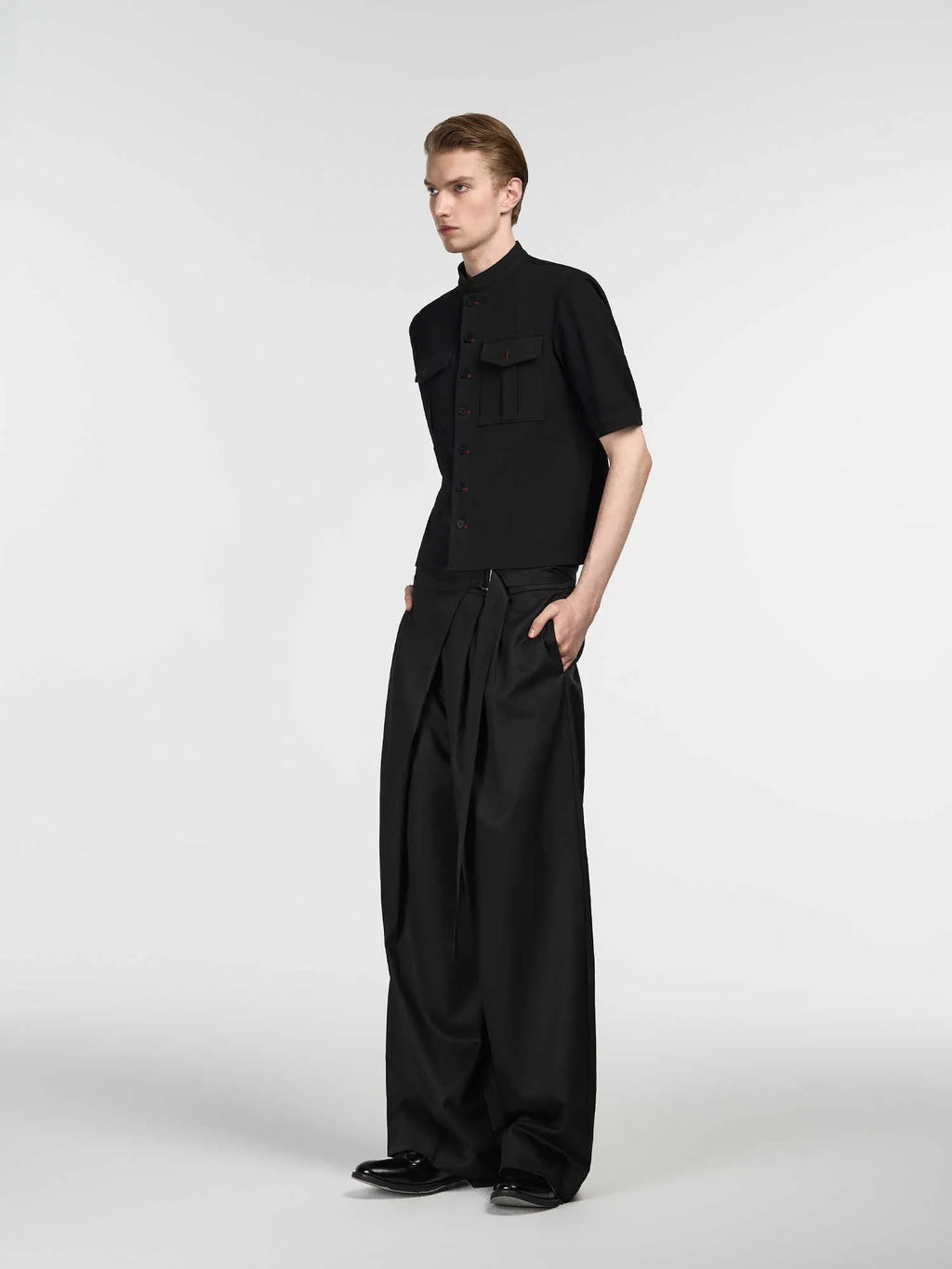 Black women's straight-leg trousers with adjustable waist and single pleat detail