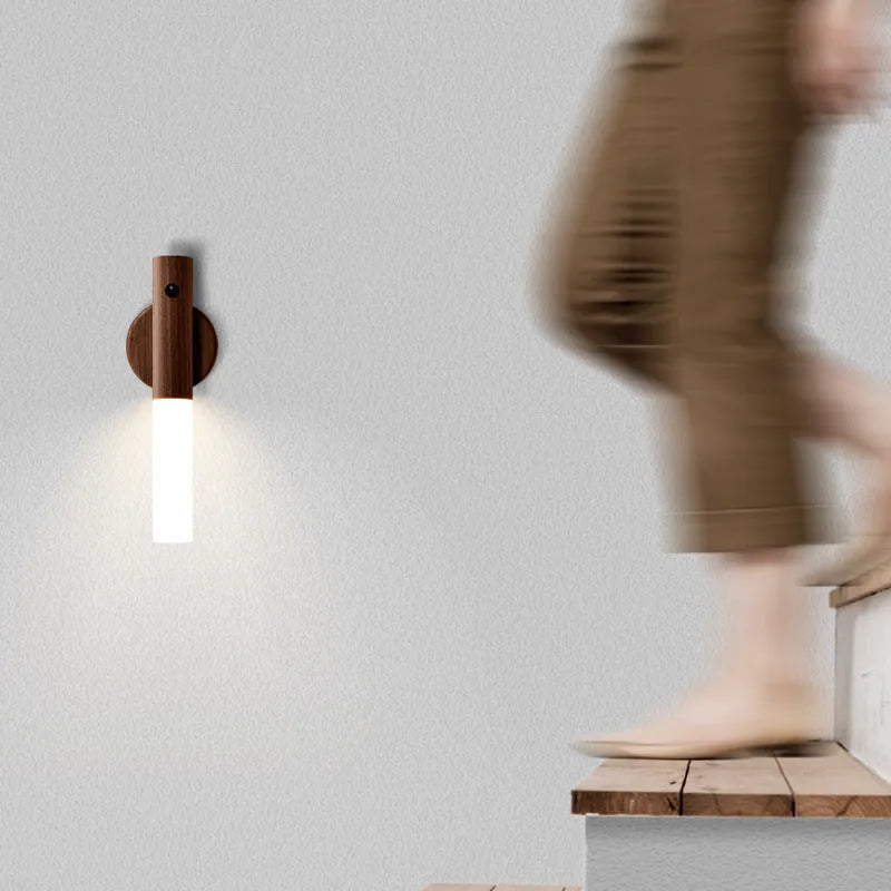 Smart sensor LED desk lamp in solid wood and organic glass with automatic motion activation.
