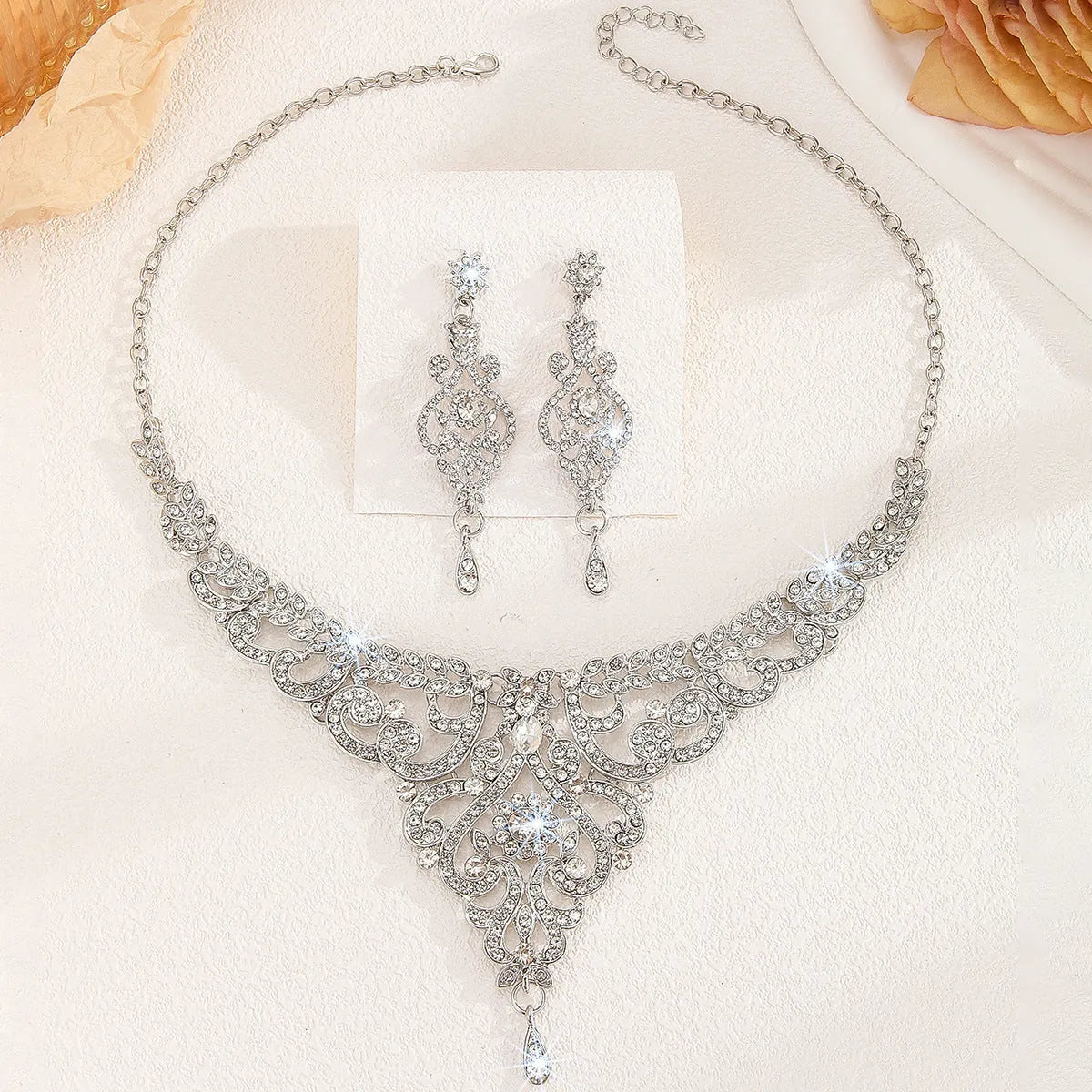 Hollow necklace and earrings set for women in gold or silver alloy with heart, water drop, or bell pattern