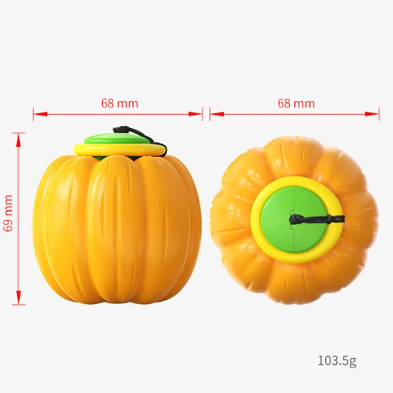 Plastic orange pumpkin-shaped dog chew toy with squeaker for small dogs on a green background.