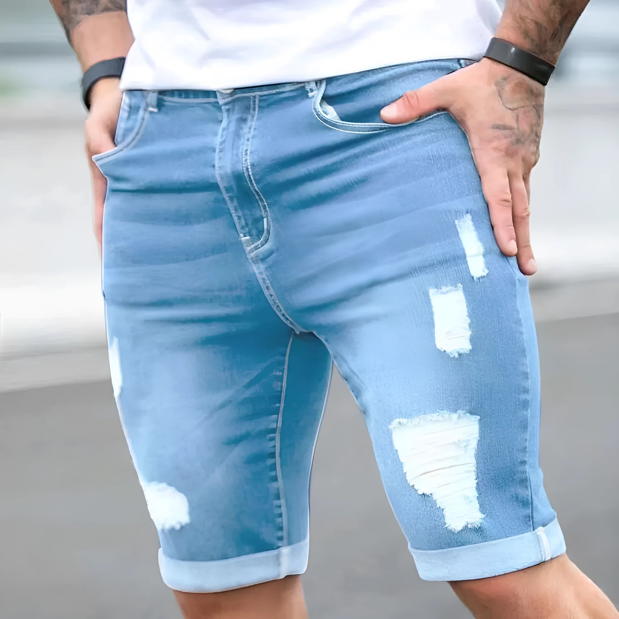 Sky blue men's denim shorts with multi-hole distressed design and low waist straight cut