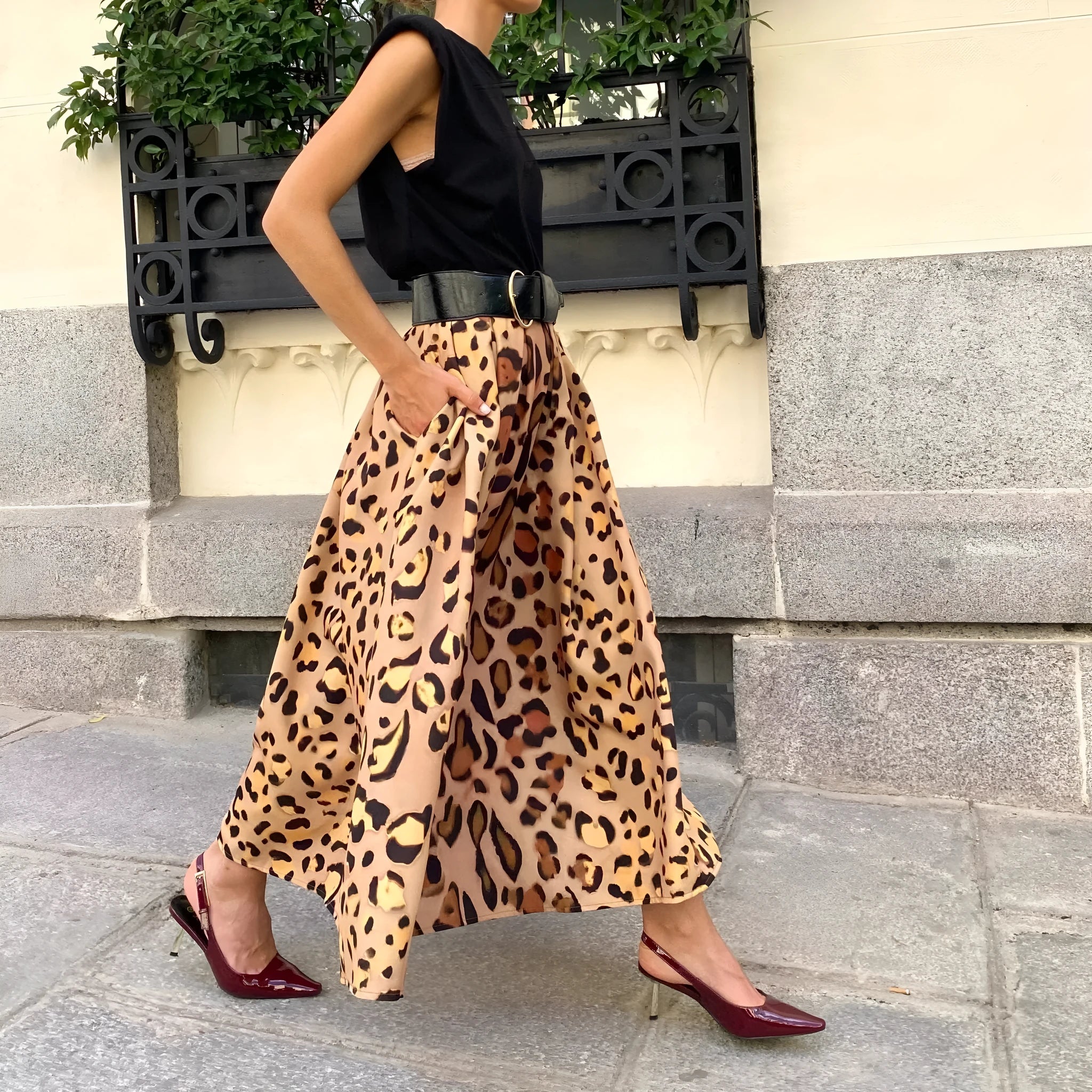 Women's brown leopard print A-line long skirt with big hem detail and animal pattern design