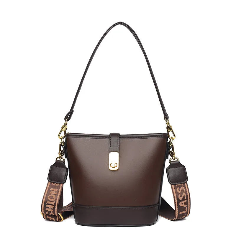 Soft black PU bucket style messenger bag with double shoulder straps, shown open to reveal internal organiser pockets.