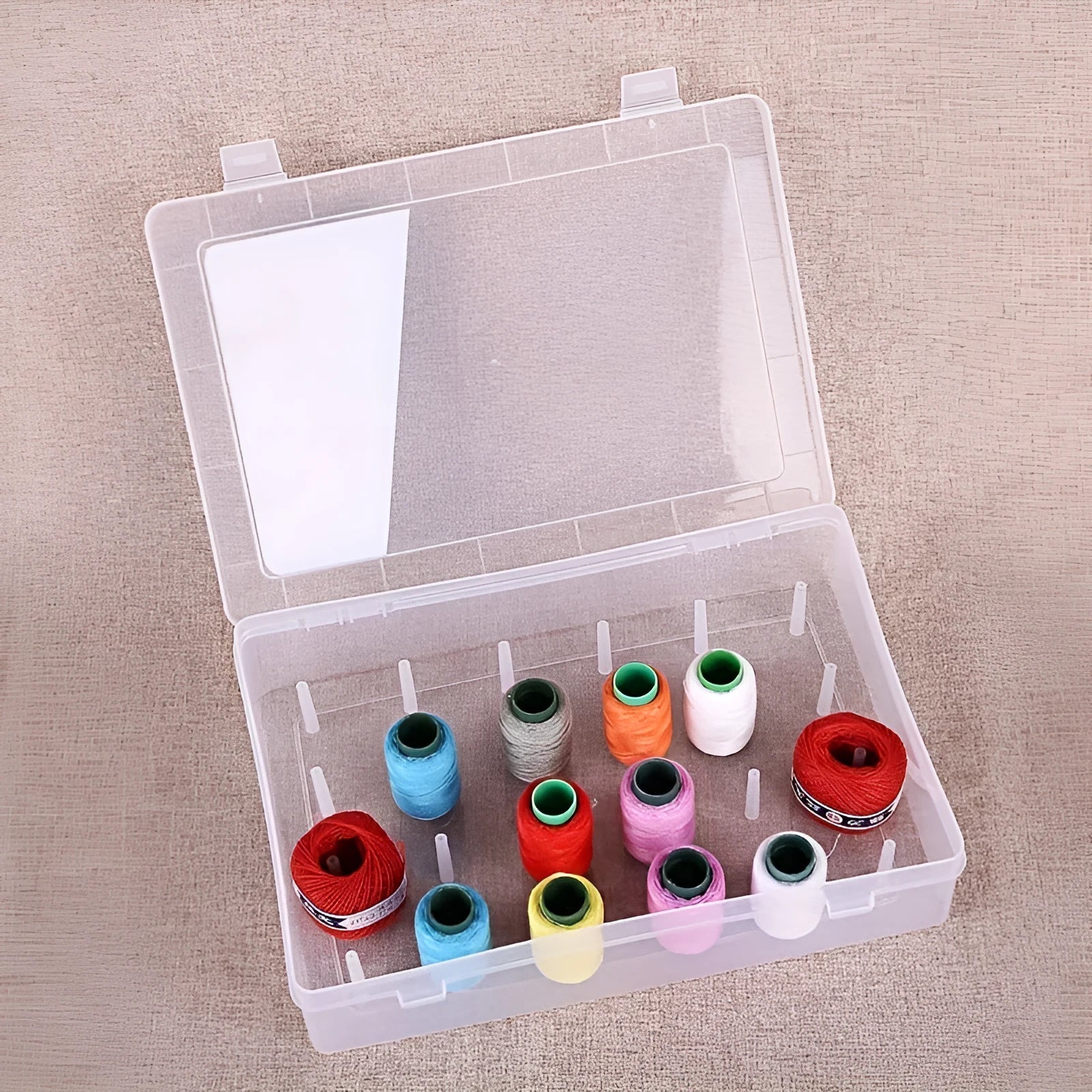 42 compartment transparent plastic storage box for embroidery threads and sewing kit organisation.