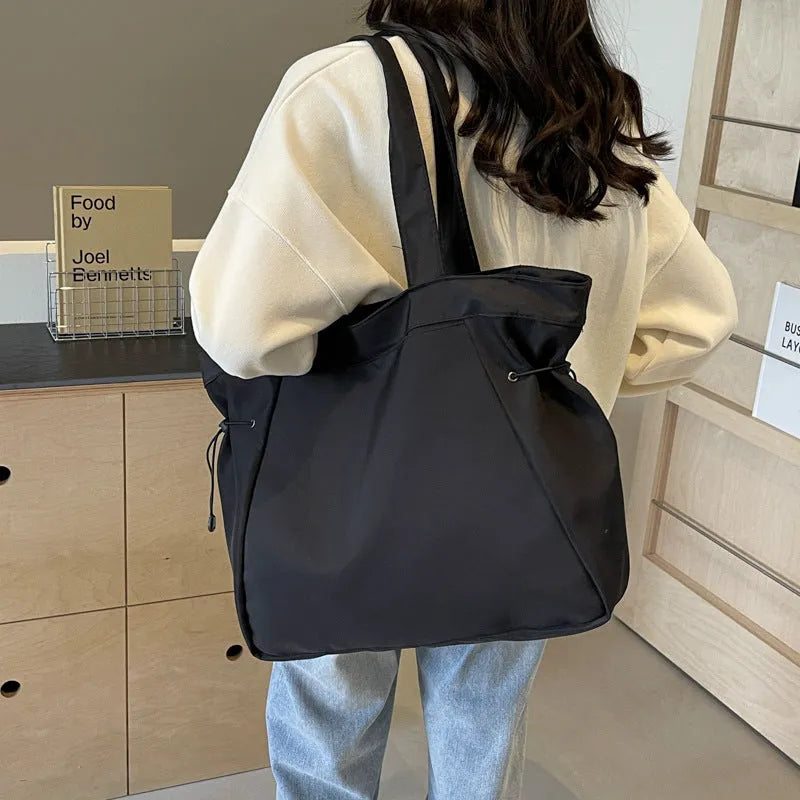 Soft foldable Oxford cloth women's shoulder tote bag shown in available colours: black, brown, dark grey, light grey, purple.