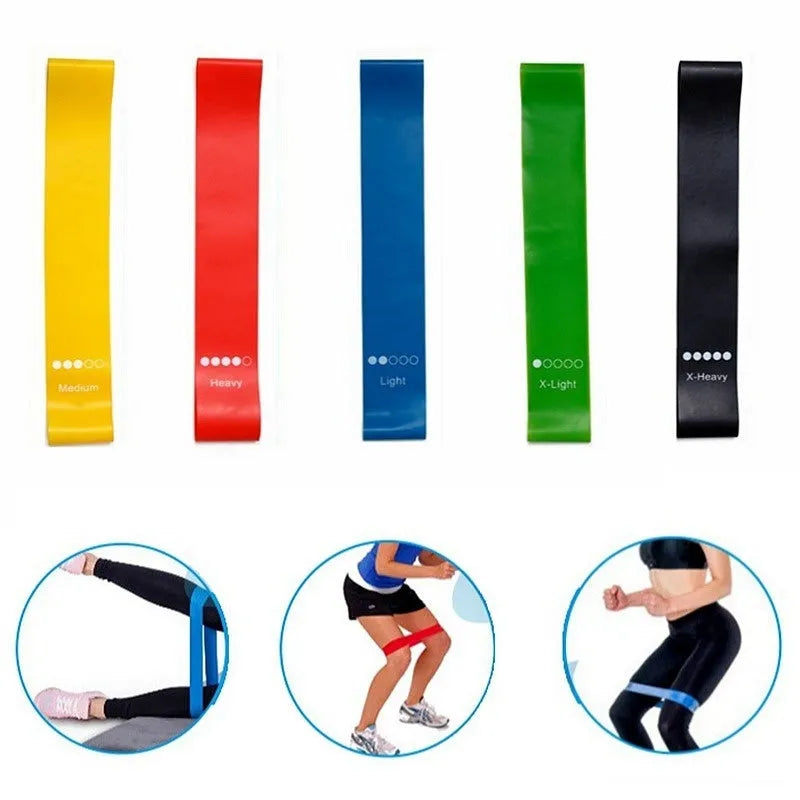 Five yoga stretching bands in different colours showing graduated thickness for progressive resistance training