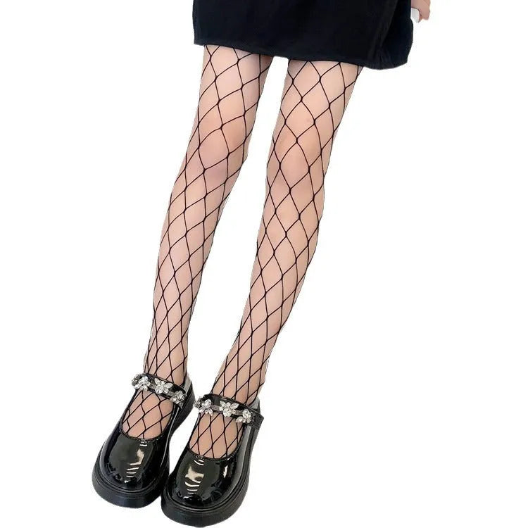 Women's black and white mesh stockings showing large, medium and small net patterns on thin velvet fabric