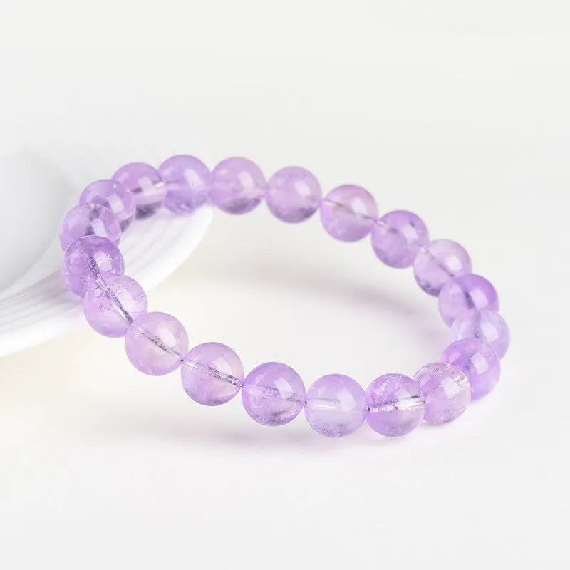 Lavender round bead amethyst bracelet with water ripple design, shown in cream and transparent colour options.