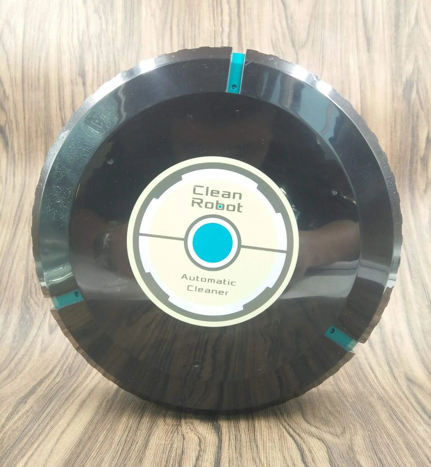 Black or white AC Sweeping Robot automatic floor cleaner on wooden floor