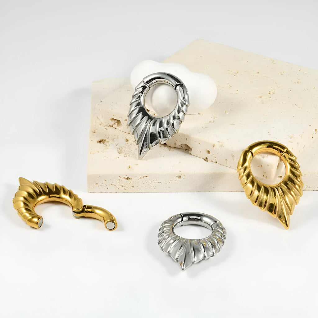 Stainless steel drop-shaped auricle ear extender with totem detailing in four colour styles