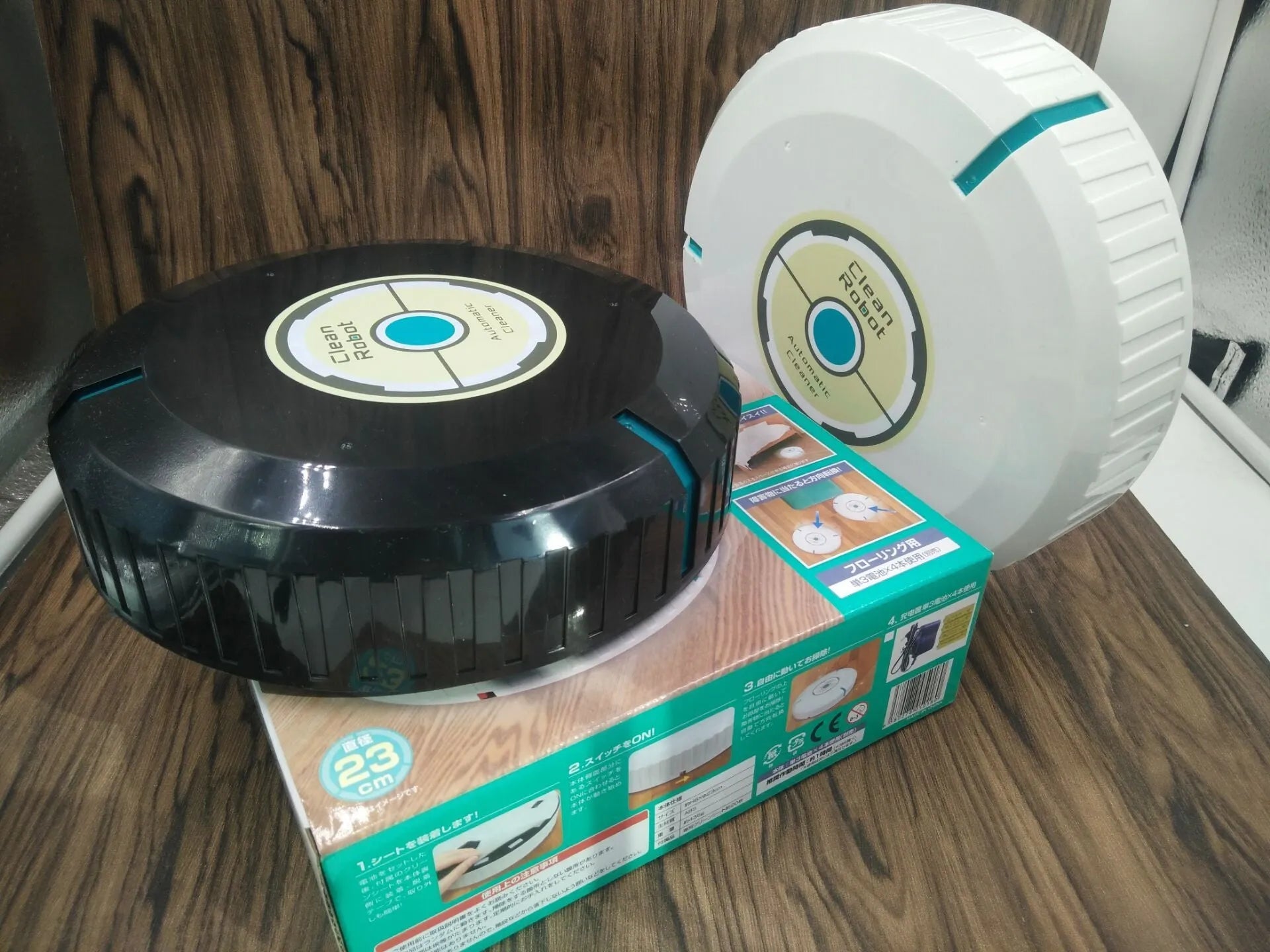 Black or white AC Sweeping Robot automatic floor cleaner on wooden floor