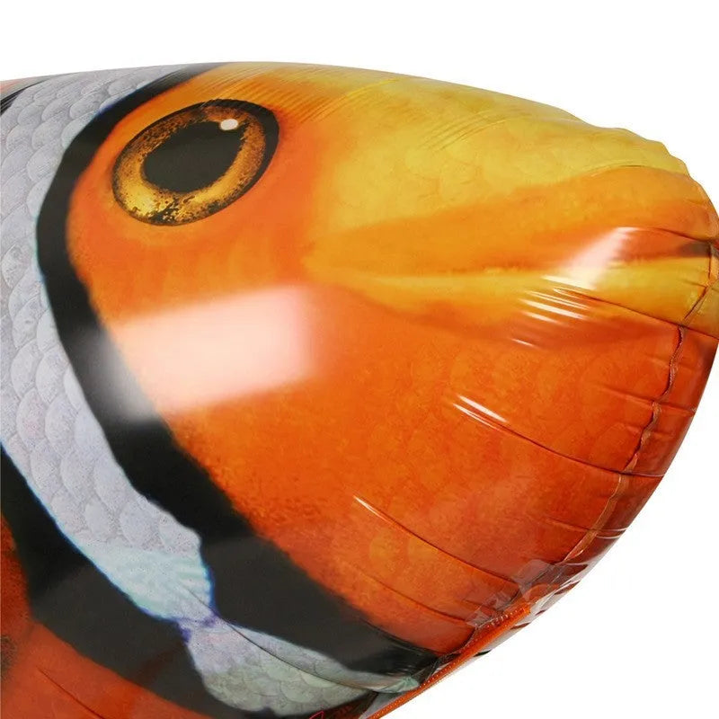 Large remote control inflatable shark balloon toy floating indoors with remote controller.