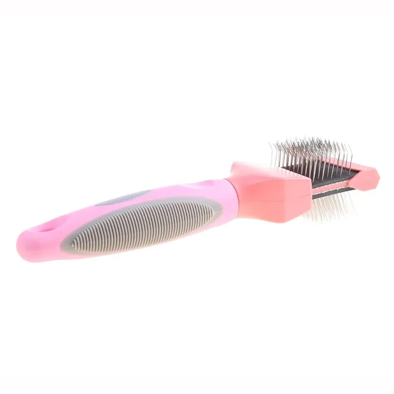Blue and pink double-sided pet brushes showing soft bristles and stainless steel pins on a non-slip handle.