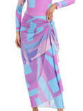 Conservative long sleeve swimsuit and apron set for women in blue, on a hanger.