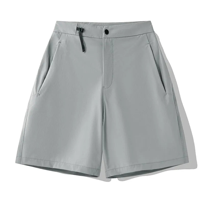 Men's solid colour sport shorts with elastic waistband, shown in army green, for running and climbing activities.