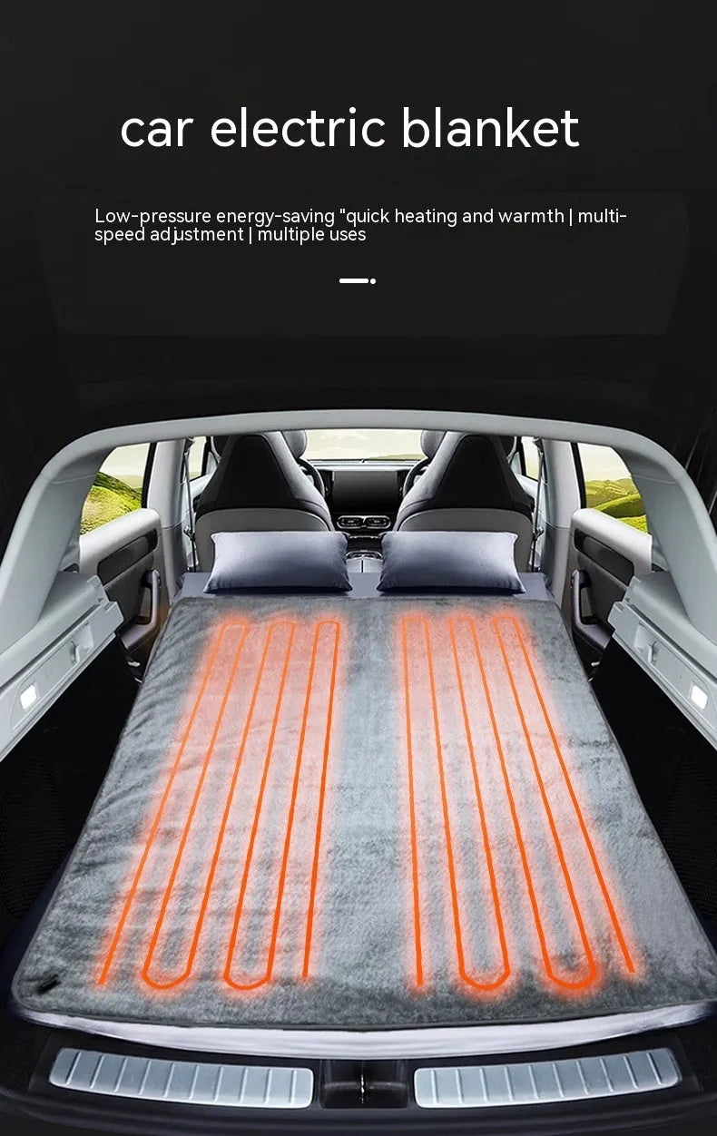 Grey 12V car electric blanket with digital controller, shown plugged into a car cigarette lighter socket.