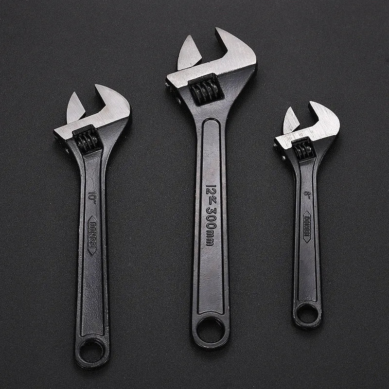 Blackened high carbon steel adjustable open-end wrench showing adjustable jaw mechanism and ergonomic handle