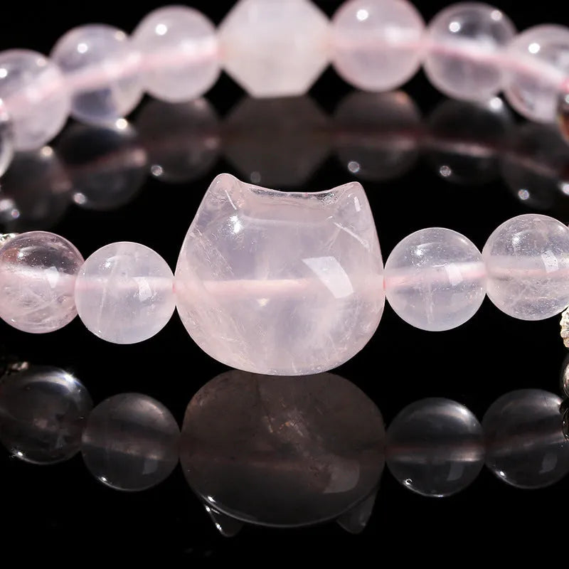 Women's natural starlight pink crystal cat head bracelet with copper detail and geometric round beads