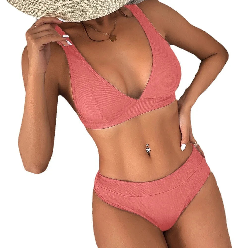 Women's black lace-up front bikini with split sides on a mannequin, showing high-waisted fit.